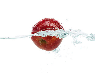 Image showing apple falling or dipping in water with splash