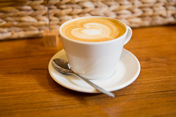 Image showing close up of coffee cup with heart shape drawing