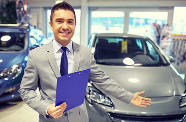 Image showing happy man at auto show or car salon