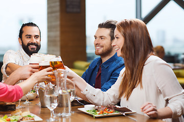 Image showing friends dining and drinking beer at restaurant