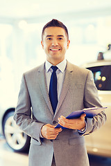 Image showing happy man at auto show or car salon