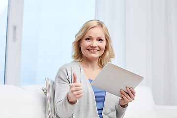 Image showing happy woman with tablet pc showing thumbs up