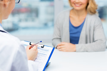 Image showing close up of doctor and woman meeting at hospital