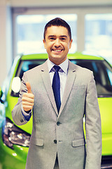 Image showing man showing thumbs up at auto show or car salon