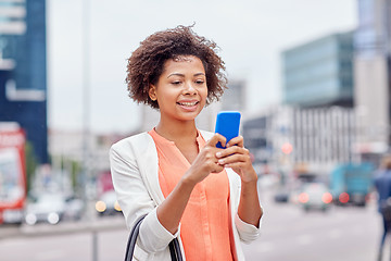 Image showing happy african businesswoman with smartphone