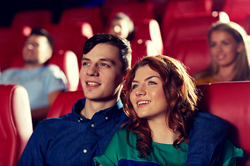 Image showing happy friends watching movie in theater