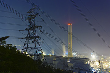 Image showing power station at night with smoke 