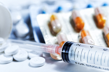 Image showing Syringe with glass vials and medications pills drug