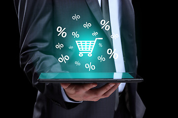 Image showing Businessman hand touch online shopping icons on a tablet