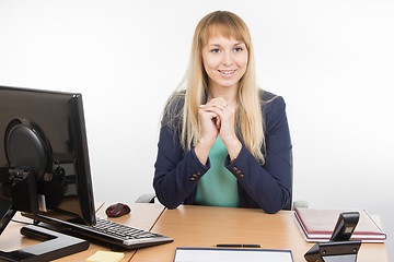 Image showing Beautiful girl secretary meets visitor