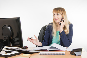 Image showing Business woman finds the right information on the phone