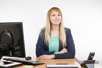 Image showing Beautiful girl secretary waits for visitor