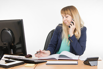 Image showing Business woman talking on the phone and understands that a planned meeting did not take place