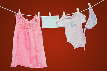 Image showing Baby goods hanging on the clothesline