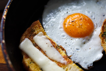 Image showing fried egg and bread with cheese