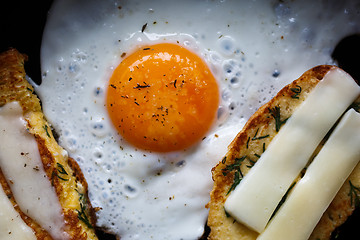 Image showing fried egg and bread with cheese