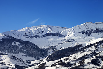 Image showing Snowy sunlight mountains at sun day