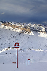 Image showing Ski slope at evening and storm sky