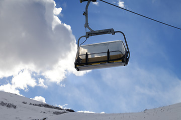 Image showing Chair-lift in ski resort at sun evening