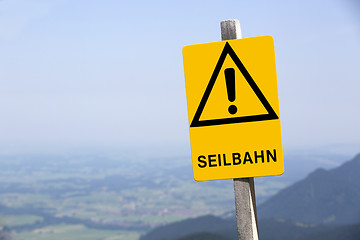 Image showing Yellow sign of ropeway