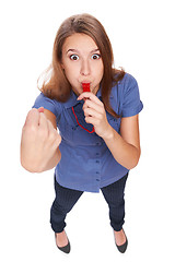 Image showing Female blowing a whistle and pointing at you