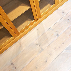 Image showing Empty bookcase on wooden floor