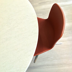 Image showing Leather chair and round marble table