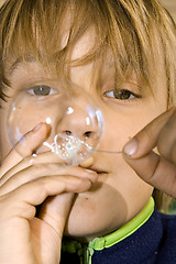 Image showing boy blowing bubbles