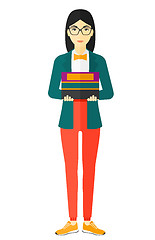 Image showing Woman holding pile of books.