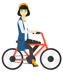 Image showing Woman riding bicycle.