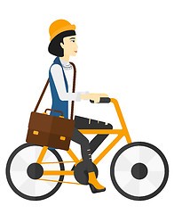 Image showing Woman cycling to work.
