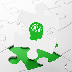 Image showing Learning concept: Head With Finance Symbol on puzzle background