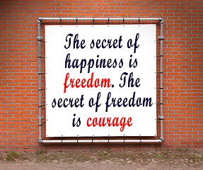 Image showing Large banner with inspirational quote on a brick wall