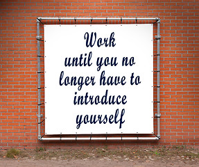 Image showing Large banner with inspirational quote on a brick wall