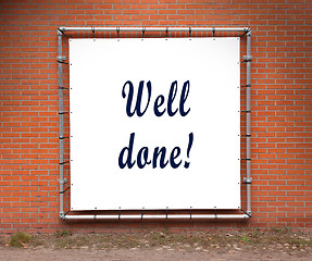 Image showing Large banner with inspirational quote on a brick wall