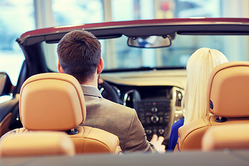 Image showing couple sitting in cabriolet car at auto show