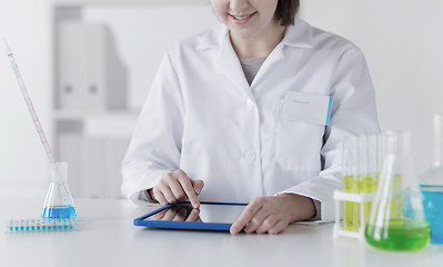 Image showing close up of scientist with tablet pc in lab