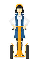 Image showing Woman riding on electric scooter.