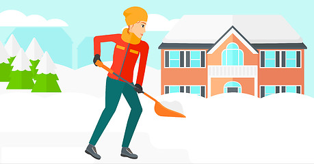 Image showing Woman shoveling and removing snow.