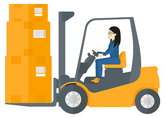 Image showing Worker moving load by forklift truck.