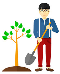 Image showing Man plants tree.