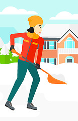 Image showing Woman shoveling and removing snow.