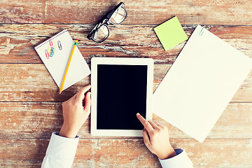 Image showing close up of female hands with tablet pc and coffee