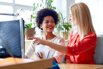 Image showing happy women or students with computer in office