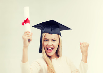 Image showing student in graduation cap with certificate