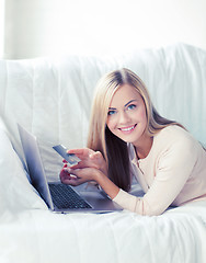 Image showing businesswoman with laptop and credit card