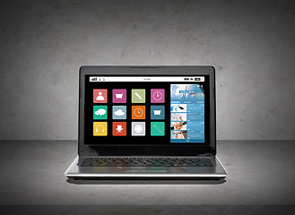 Image showing laptop computer with application icons screen
