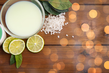 Image showing close up of citrus body lotion in bowl on wood