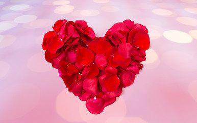 Image showing close up of red rose petals in heart shape