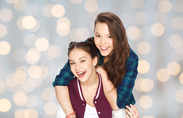 Image showing happy smiling pretty teenage girls hugging